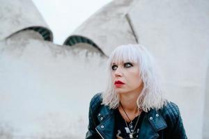Portrait of stylish blonde grunge blonde woman on the futuristic background photo