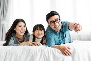 small asian family portrait at home photo