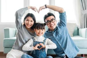 small asian family portrait at home photo