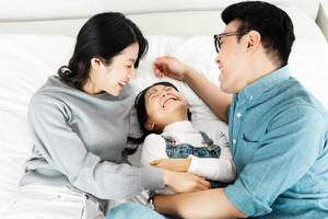 small asian family portrait at home photo