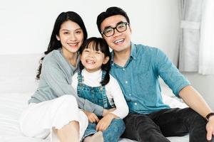 small asian family portrait at home photo