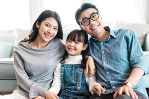 small asian family portrait at home photo