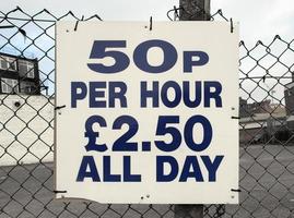 Parking sign 50p per hour photo