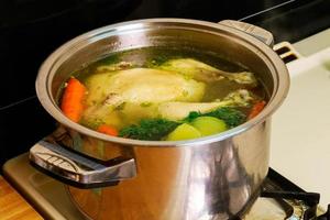 Chicken soup in a bowl with crackers. photo