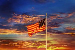 American flag in front of bright sky photo