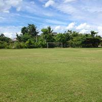 Soccer field with cloudy in the countryside. photo