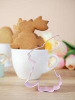 Easter background. Happy Easter eggs in the nest. Easter eggs. Rabbit. Cookies. copy space photo