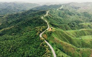 Asphalt curved highway on mountain photo