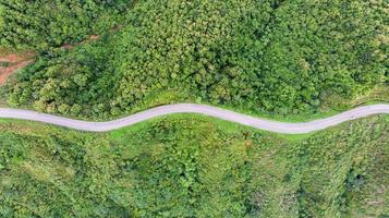 Asphalt curved highway on mountain photo