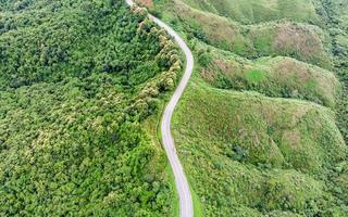 Asphalt curved highway on mountain photo