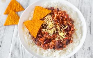 Chili con carne served with white rice photo