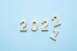 2022 wooden text number on blue background. photo