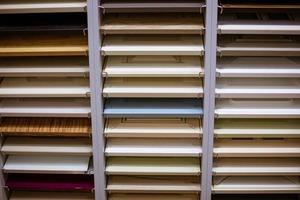 Shelves of different colors on the shelves in the store photo