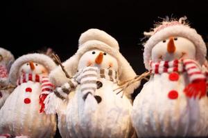 Toy snowman on the shelf in the store photo