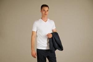 young adult man posing emotionally on a white background photo