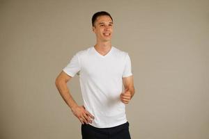 young adult man posing emotionally on a white background photo