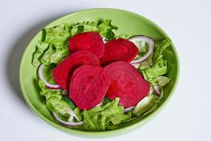 Healthy salad with beets and mixed greens photo