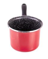 red pot with black pen isolated on white photo