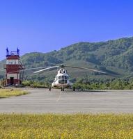 The Helicopter on the helipad on Kamchatka photo