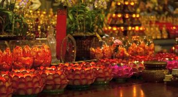 The blurred image of Red candle on table in Chinese Buddhist temple for renew life or navigate life in Chinese temple photo