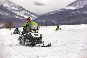 show on the holiday competition snowmobiles in Kamchatka photo