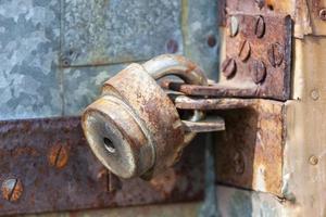 The padlock on the door. Rusty gate photo