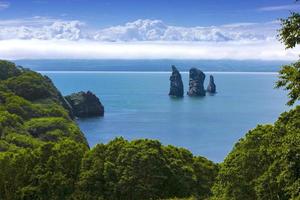 The Three Brothers Rocks in the Avacha Bay of the Pacific Ocean. The coast of Kamchatka