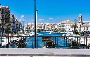 Quiet and peaceful view of typical fisher boats and colorful houses from the bridge photo