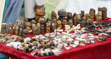 Kamchatka Aboriginal souvenirs for sale on a red background photo