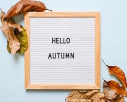 Inscription Hello October on white letter board photo