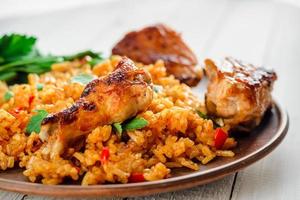 Chinese rice. Fried rice with vegetables and chicken in sauce photo
