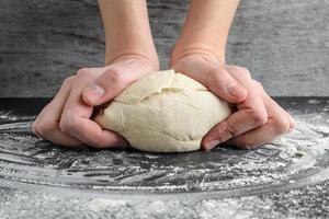 The woman weighs the dough photo