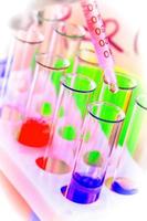 The test tubes and flasks with colored liquid in a laboratory photo