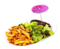 The plate of traditional schnitzel with potato fries on white background photo