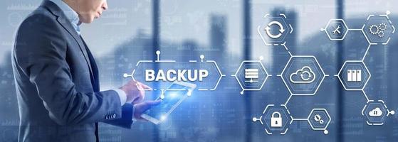 Backup Storage Data Technology concept. Businessman touching Backup photo