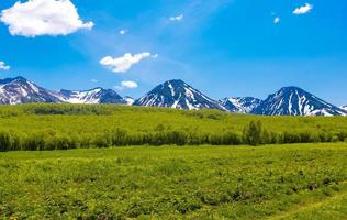 The summer landscape in mountains and the blue sky with clouds photo