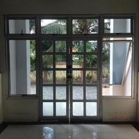 the white door made of mild steel and translucent glass photo
