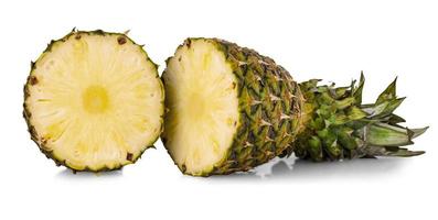 The fresh pineapple cut in half on white background