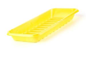 Yellow plastic tableware food container isolated over the white background photo