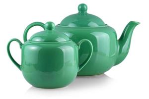 The green teapot and sugar bowl on white photo