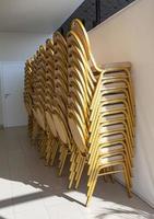 folding office chairs near the wall photo