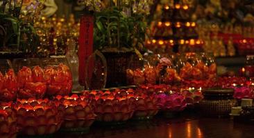 The Red candle on table in Chinese Buddhist temple for renew life or navigate life in Chinese temple photo