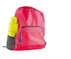 The red women's sports bag with sports bottle for a water isolated on white background photo