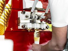 automatic machine for the production of ice cream in a waffle Cup photo