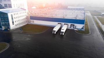 trucks are loaded in the logistics center top view photo