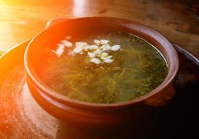 iet sorrel soup with egg. on a wooden table. photo