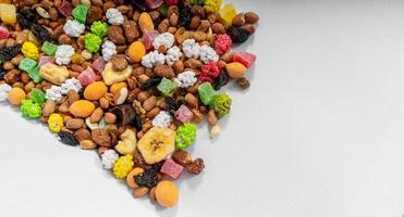 mixture of nuts,dry fruits on white background photo