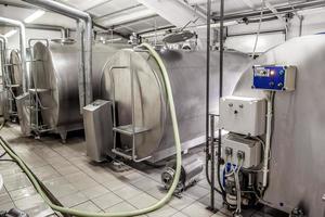 room with a refrigerator for cooling milk photo