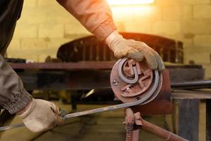 Forging and bending metal close-up photo