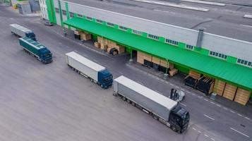 loading trucks at the factory. the view from the top photo